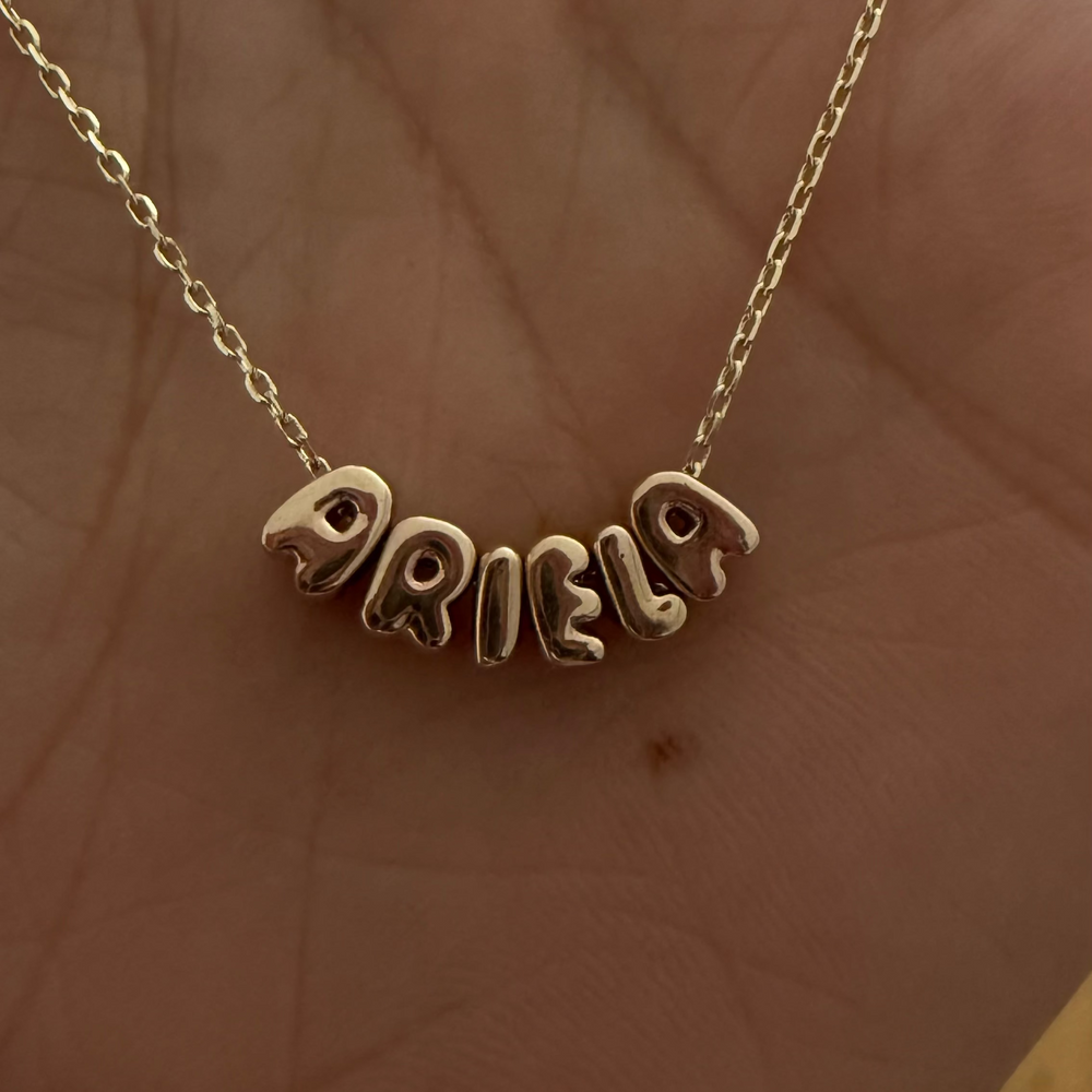 
                      
                        Letras Globo Mini en Collar
                      
                    