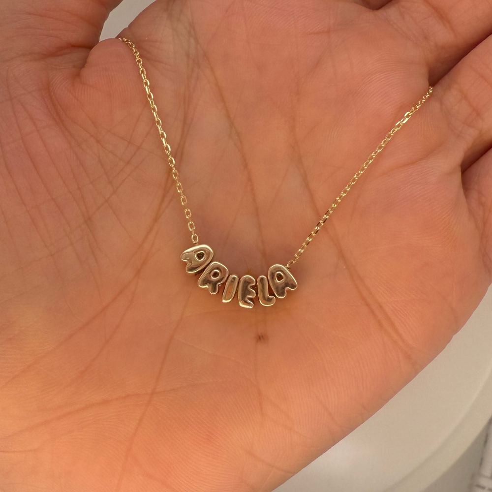 
                      
                        Letras Globo Mini en Collar
                      
                    