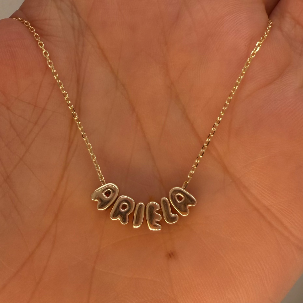 
                      
                        Letras Globo Mini en Collar
                      
                    