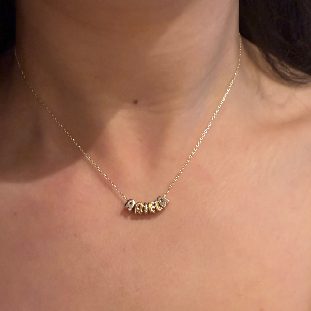 
                      
                        Letras Globo Mini en Collar
                      
                    