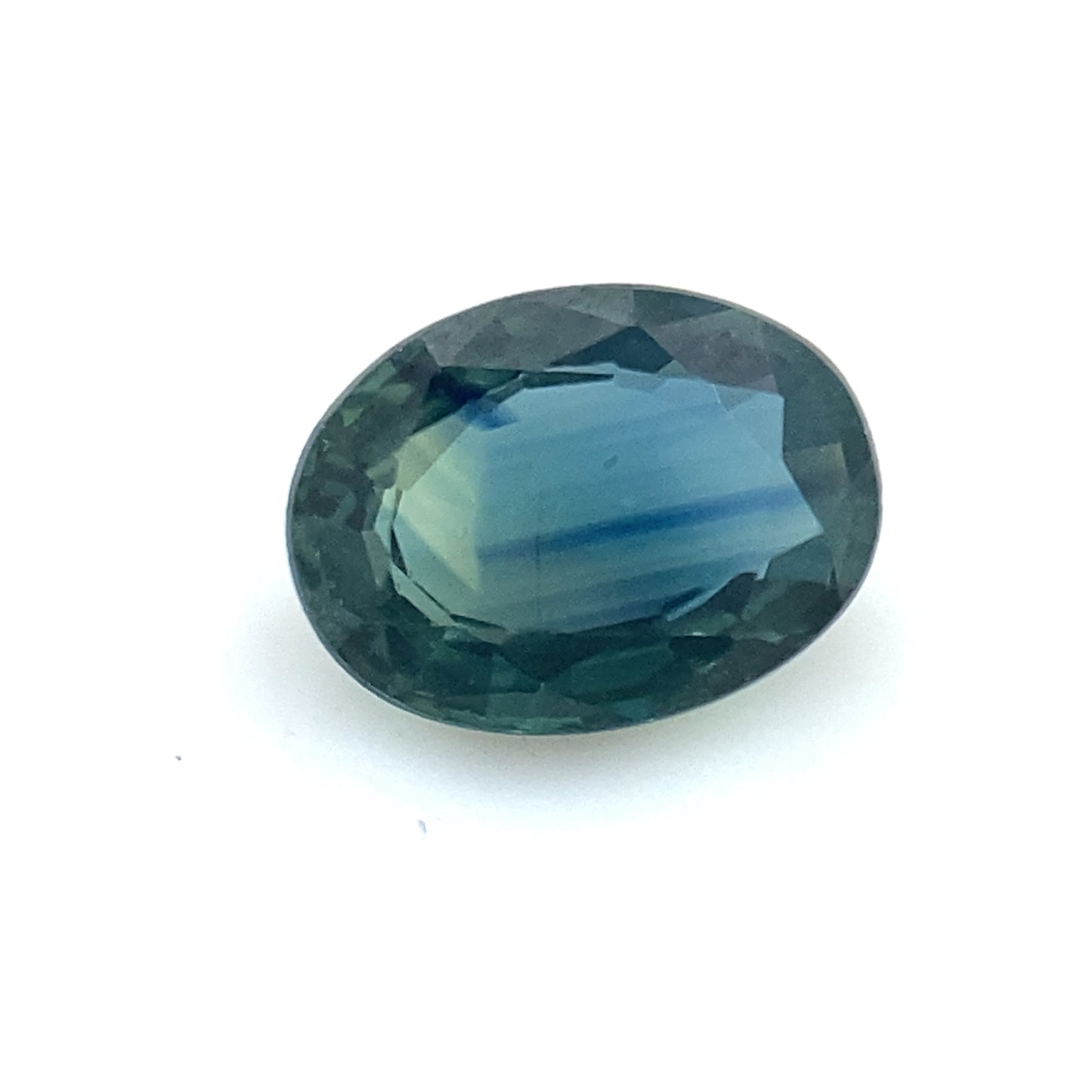 PIEDRA SUELTA / Zafiro bicolor en tonos azules y verdes corte oval de 0.87ct / Valor total 16,000 pesos