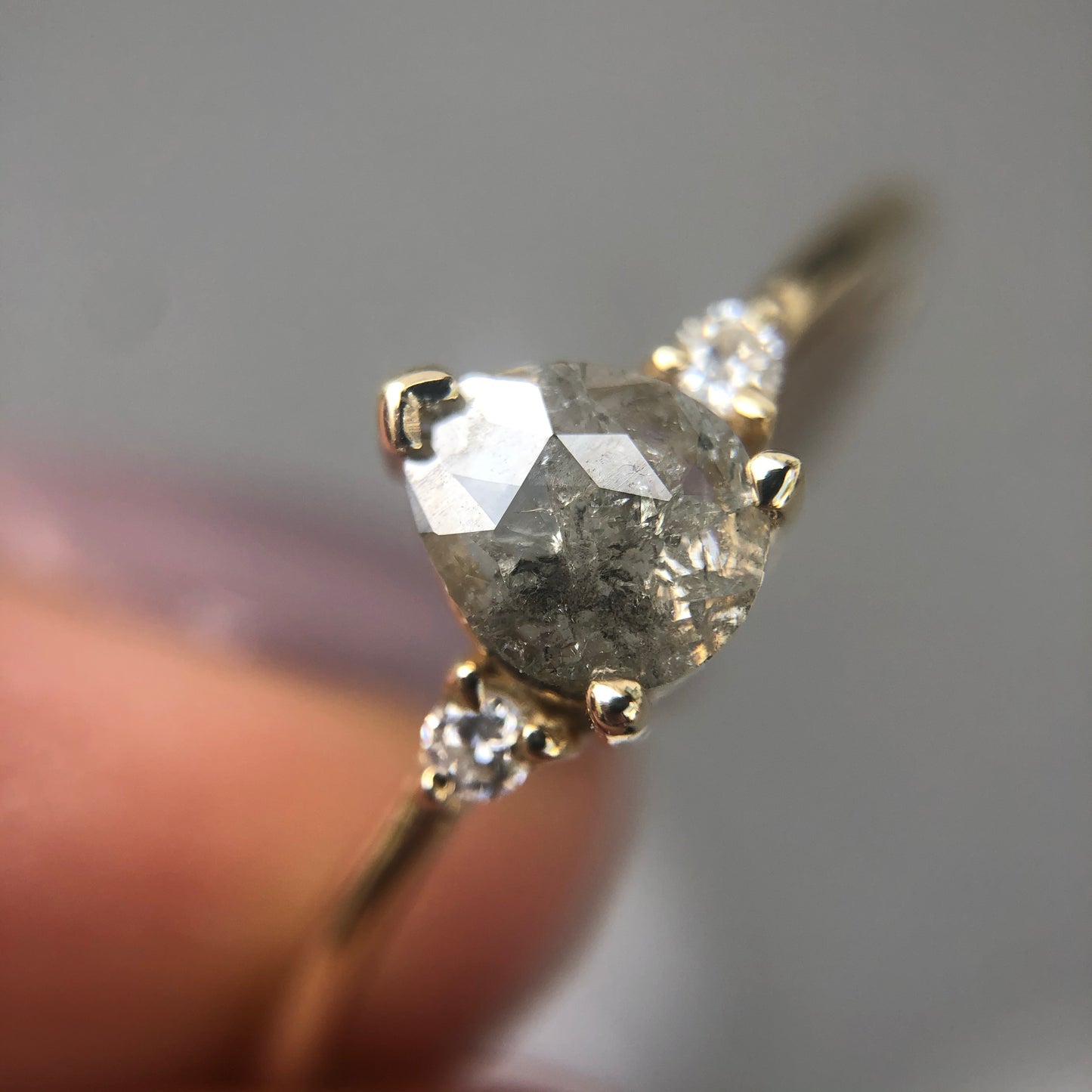 Salt and Pepper Drop Diamond Ring with side diamonds.