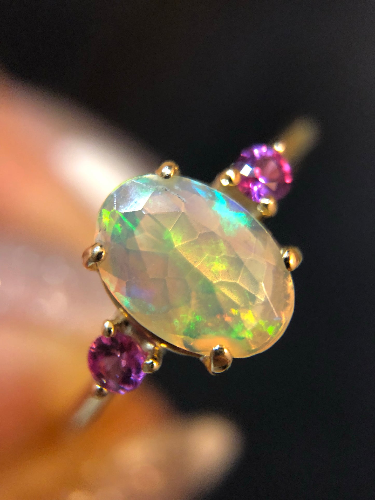 Faceted Opal ring with pink/purple sapphires