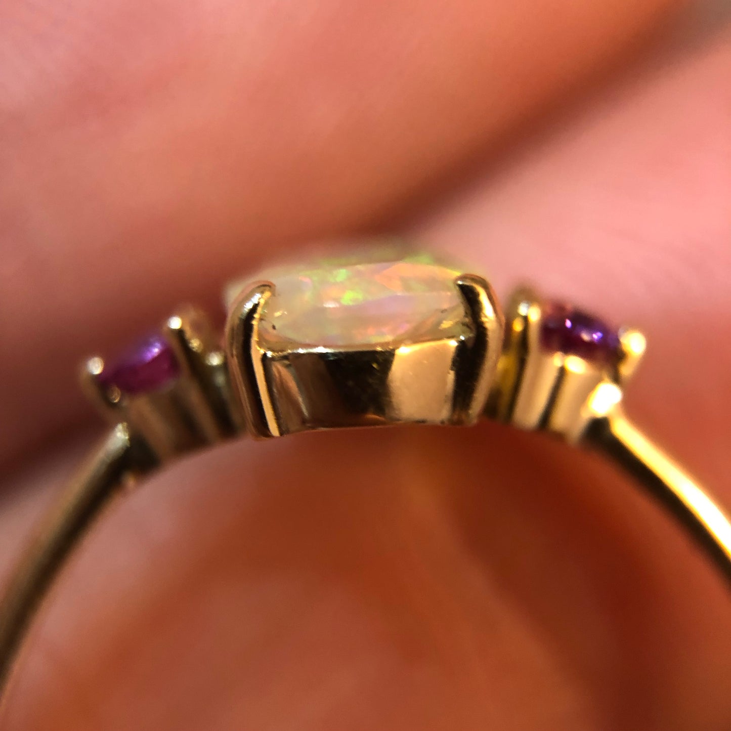 Faceted Opal ring with pink/purple sapphires