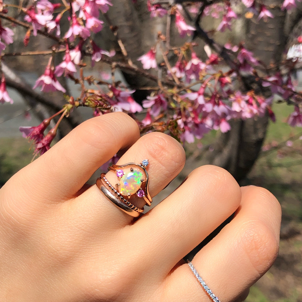 
                      
                        Opal Ring with Pink Sapphires
                      
                    